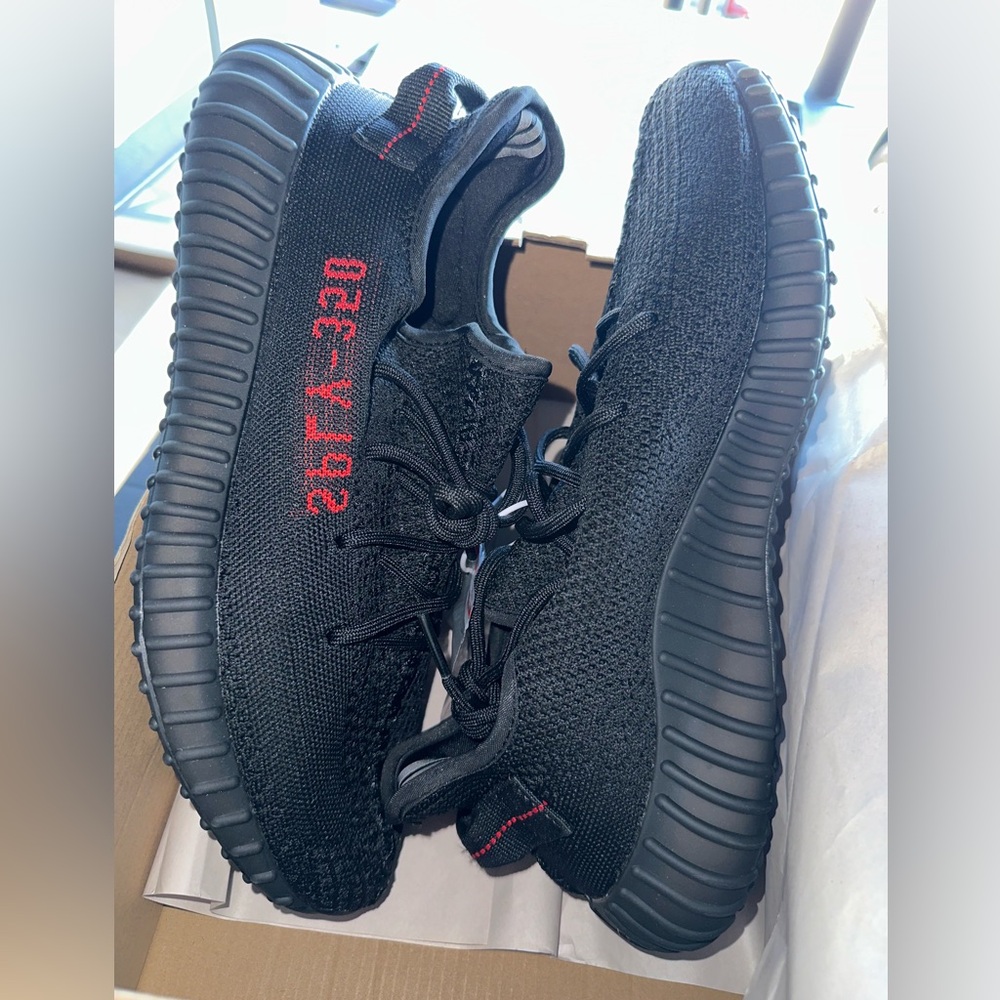 Yeezy Black and Red Athletic Shoes